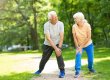Senior Couple Exercising In Park