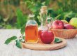 Apple cider vinegar in a bottle. Selective focus.