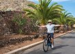 Caucasian grandfather riding with an e bike