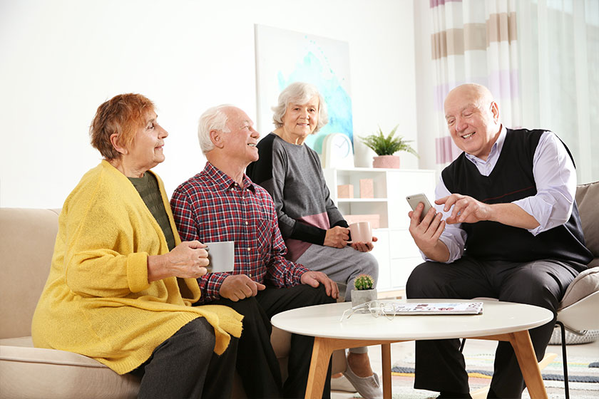 Elderly people spending time together in living room Elderly people spending time together in living room