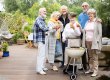 Group of happy senior people during garden party