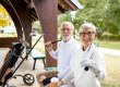Portrait of senior people in retirement holding golf clubs and ready for golf training