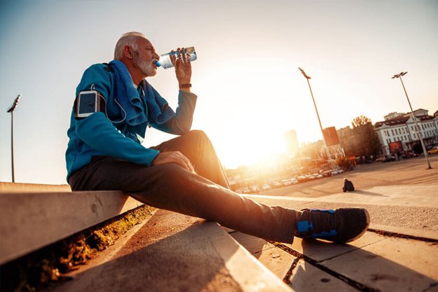 Senior man running in the city