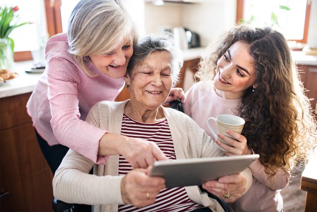 A teenage girl with mother and grandmother at home.
