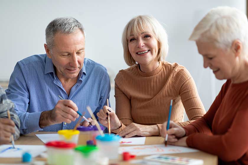 Creative senior people enjoying painting class at sanatorium Creative senior people enjoying painting class at sanatorium