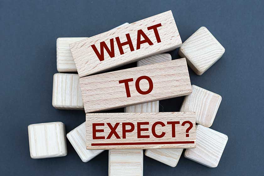 WHAT TO EXPECT? - words on wooden bars on cubes