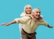 Happy retired man with outstretched hands
