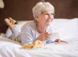 Mature woman eating breakfast