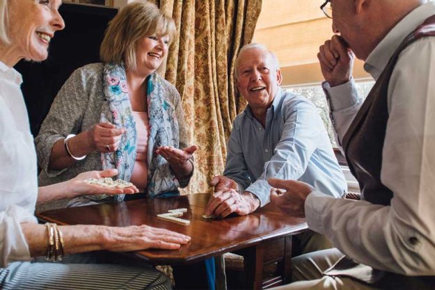 Senior Friends Playing Dominoes Senior Friends Playing Dominoes