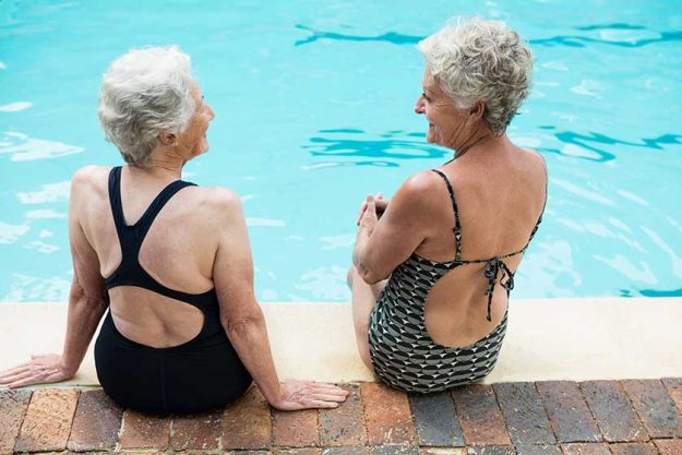 Senior women interacting with each other Senior women interacting with each other