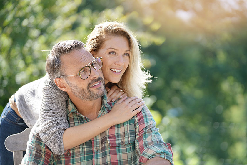 Portrait of mature couple enjoying sunny day