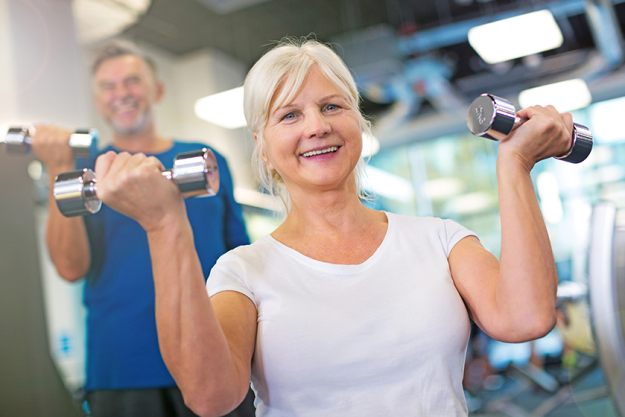 senior-couple-exercising-in-gym senior-couple-exercising-in-gym