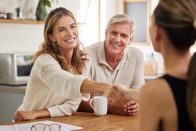 Handshake, life insurance and senior couple with lawyer for mortgage tax bills, property and financial investment. Finance, inheritance and old woman shaking hands with realtor for a successful deal. Handshake, life insurance and senior couple with lawyer for mortgage tax bills, property and financial investment. Finance, inheritance and old woman shaking hands with realtor for a successful deal.
