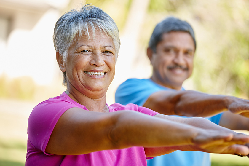 Portrait of a mature couple exercising together