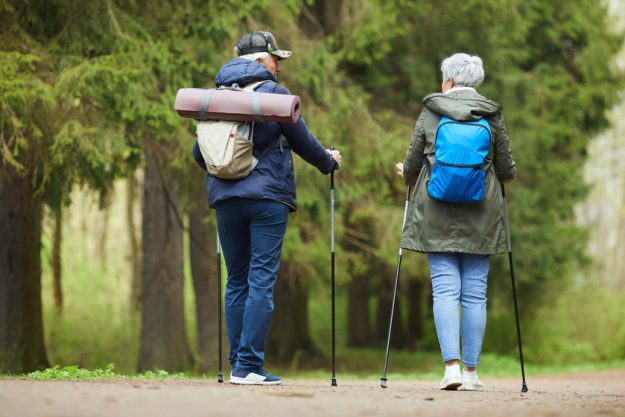 Active Senior Couple Enjoying Walk in Forest