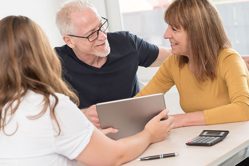 Senior couple meeting real estate agent Senior couple meeting real estate agent