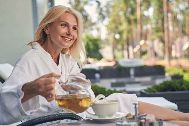Beautiful woman is relaxing in a bathrobe Beautiful woman is relaxing in a bathrobe