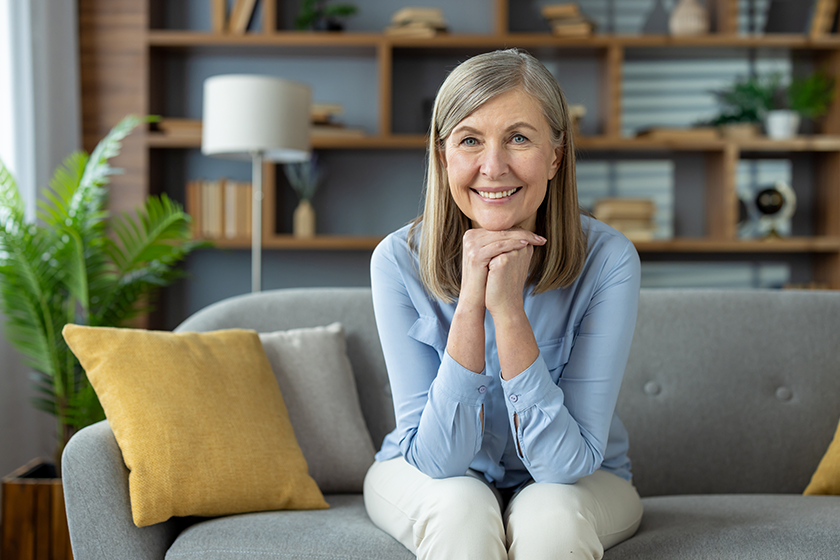 cheerful-senior-woman-gray-hair-smiling A cheerful senior woman with gray hair smiling