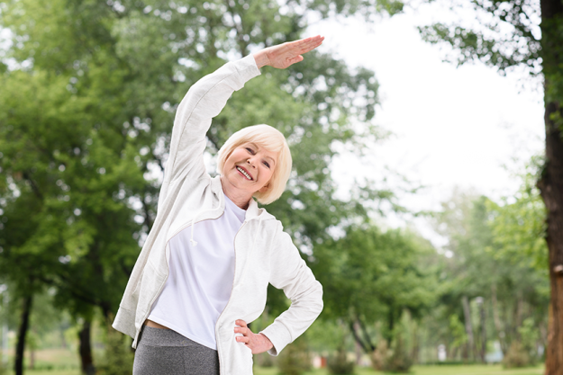 elderly-woman-sportswear-exercising-stretching
