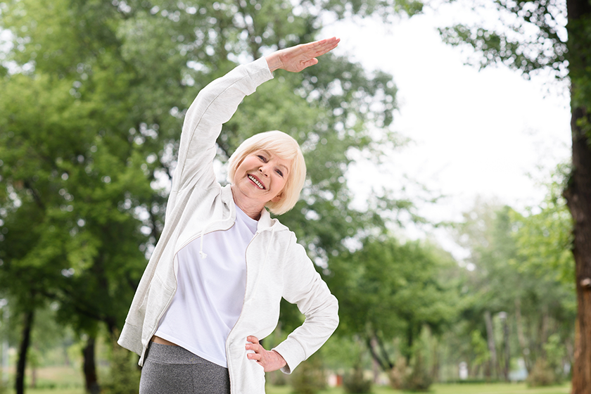 elderly-woman-sportswear-exercising-stretching elderly-woman-sportswear-exercising-stretching