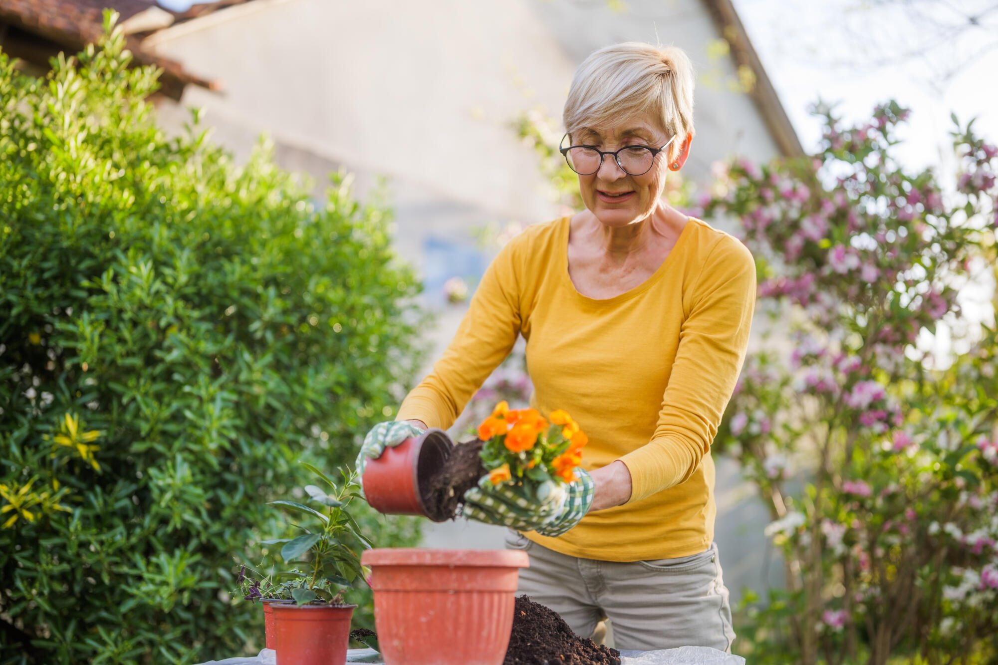 Happy-senior-woman-gardening-i